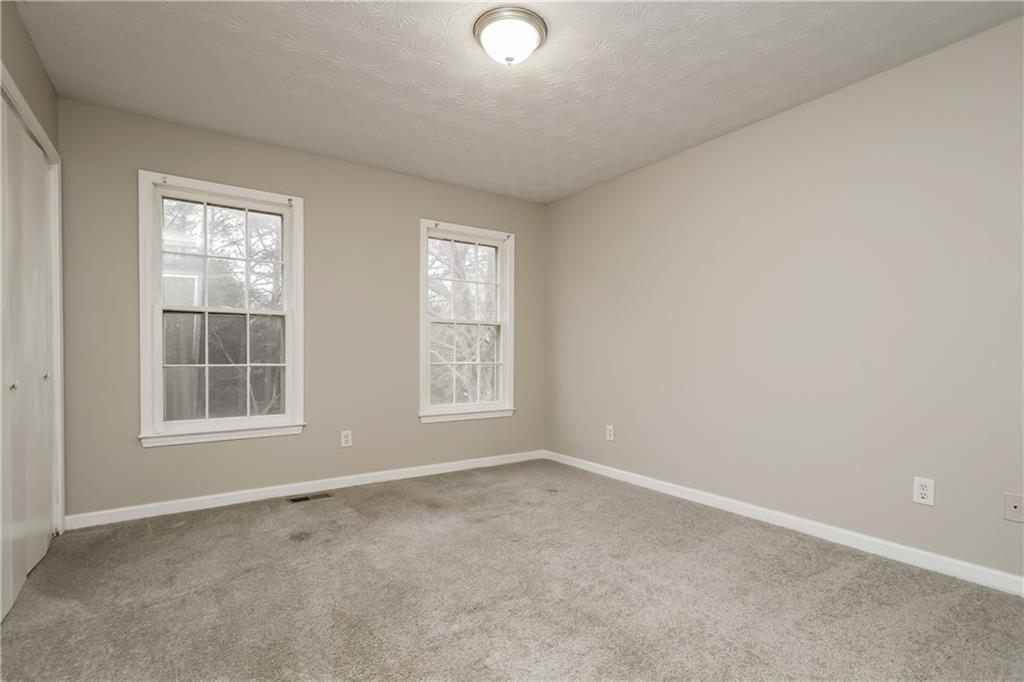 35 Knights Circle Covington, GA 30016 - Photo 17 of 28 an empty room with a window