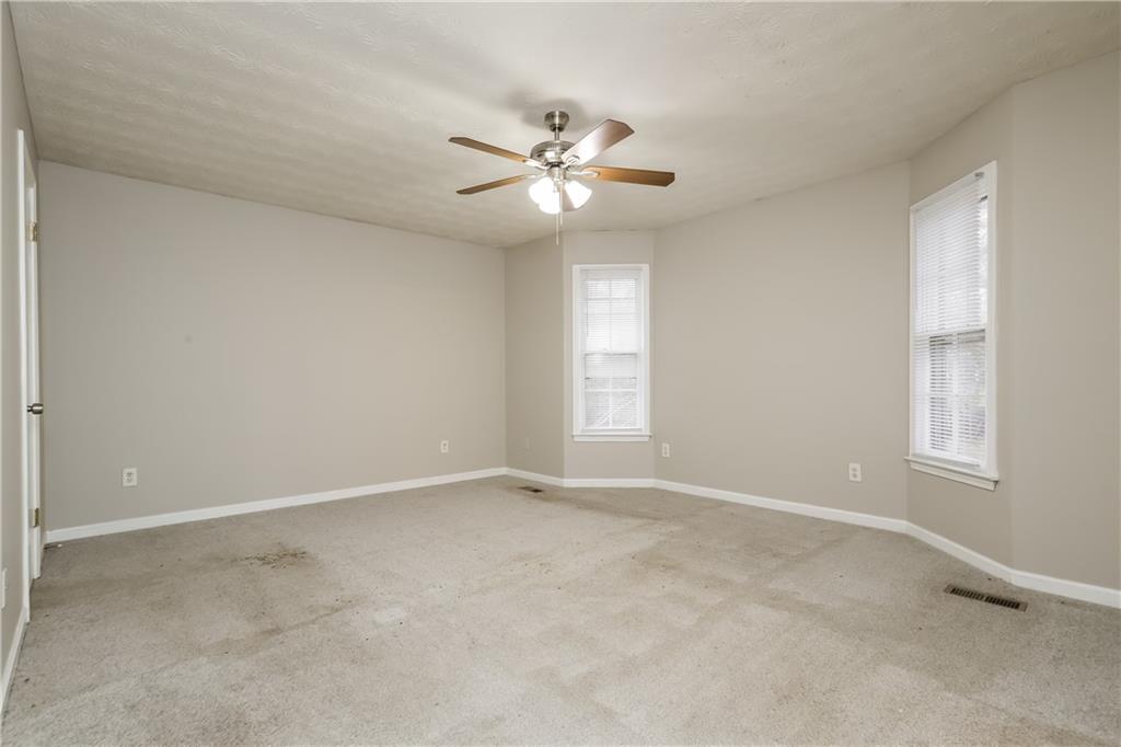 35 Knights Circle Covington, GA 30016 - Photo 7 of 28 a view of an empty room with a window