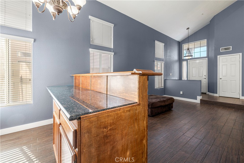 15417 Tobarra Road Fontana, CA 92337 - Photo 7 of 29 a room with furniture and window