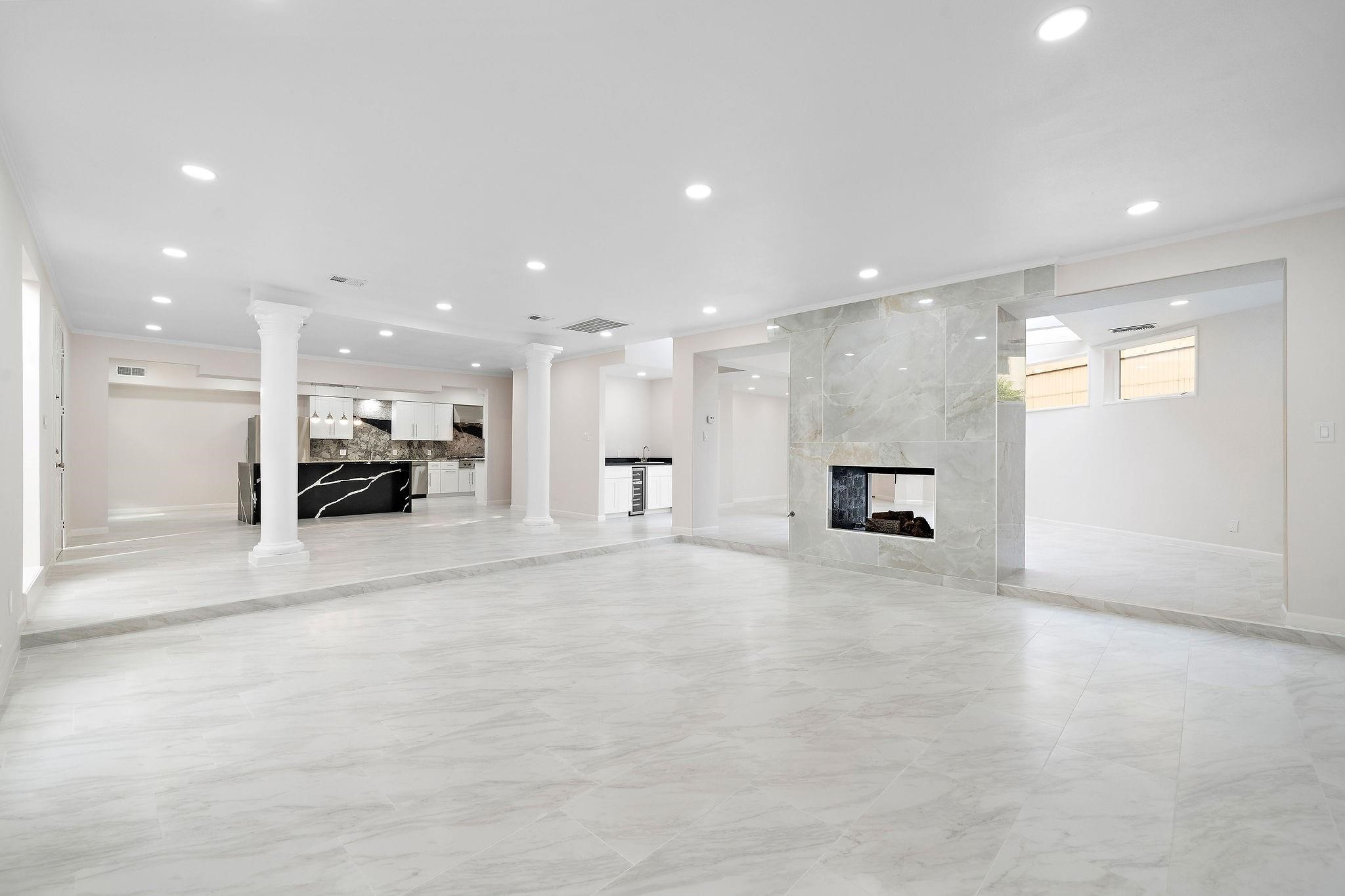 1111 Potomac Drive, Unit B Houston, TX 77057 - Photo 11 of 22 a view of kitchen with a sink and a large window in a living room