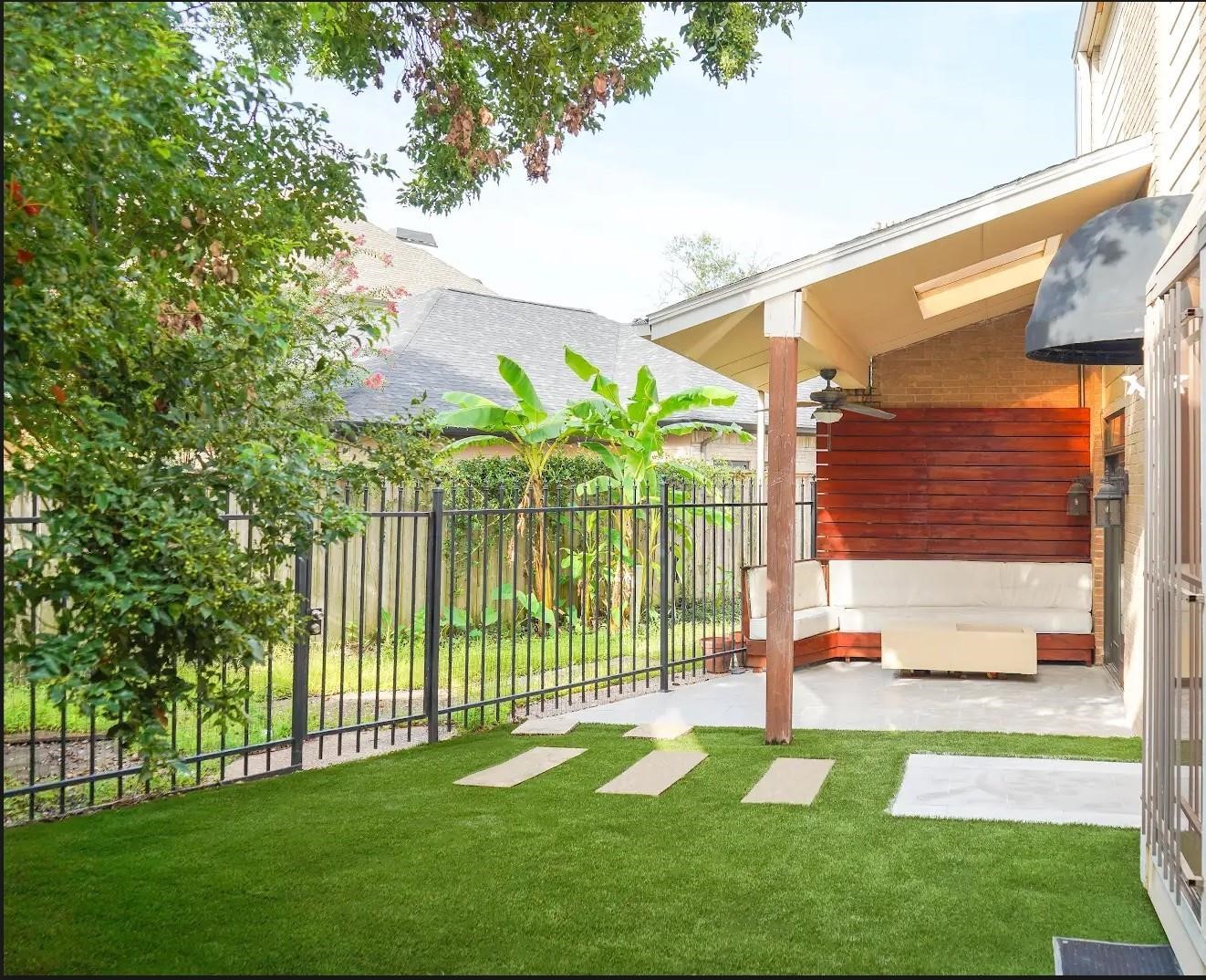 1111 Potomac Drive, Unit B Houston, TX 77057 - Photo 3 of 22 a view of a backyard with a garden