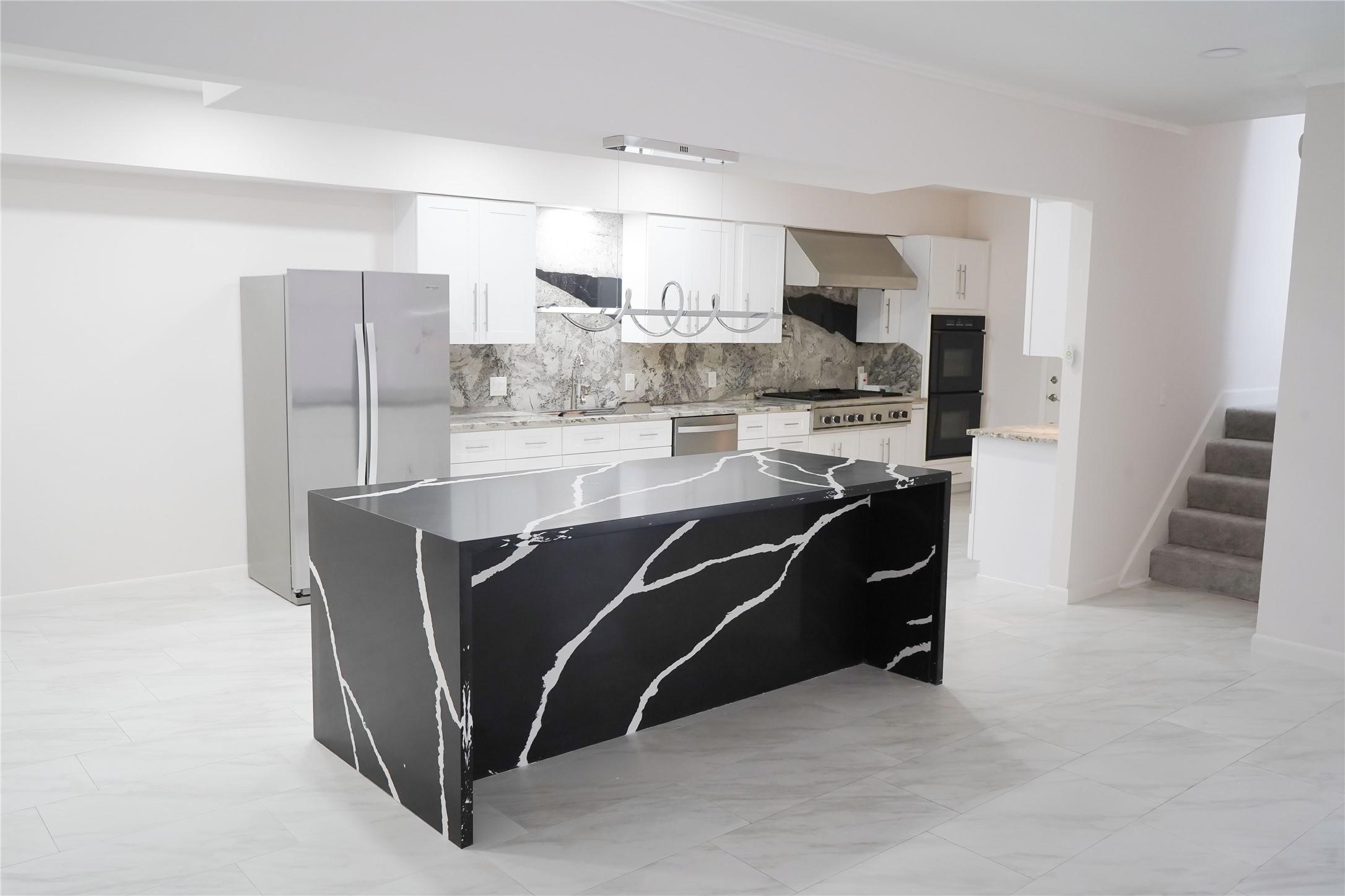 1111 Potomac Drive, Unit B Houston, TX 77057 - Photo 6 of 22 a living room with stainless steel appliances furniture a refrigerator and cabinets