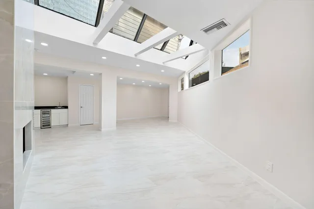 an entryway in a hall with a large window