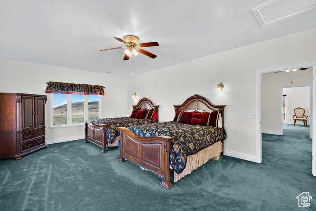 4768 East Hickman Canyon Road Stockton, UT 84071 - Photo 29 of 85 Large second floor West bedroom featuring carpet and ceiling fan.