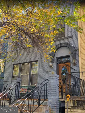 a front view of a house with outdoor area