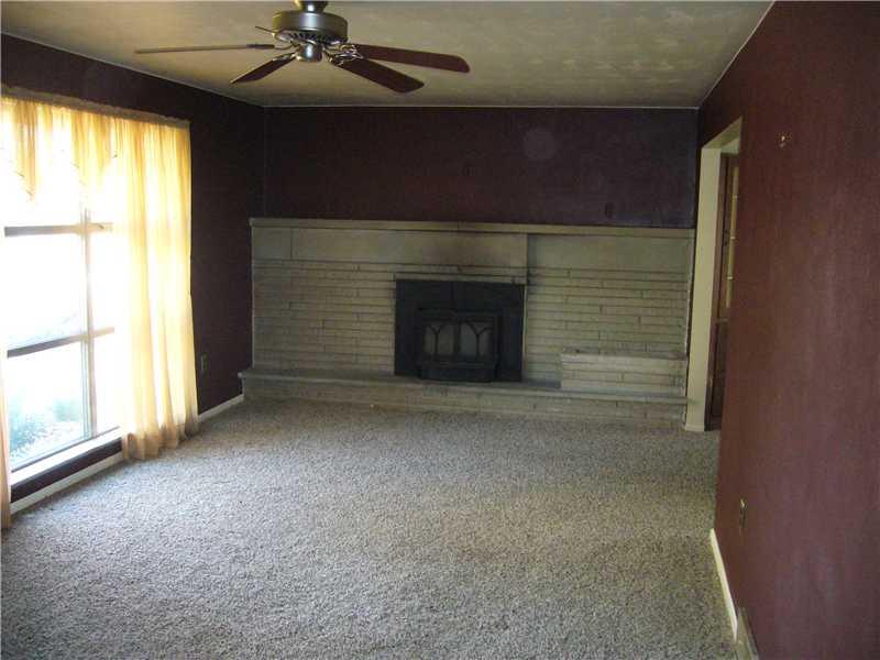 221 West Shaffer Road Aliquippa, PA 15001 - Photo 6 of 11 Living Room. Wood burning stone fireplace, newer carpet and large picture window!