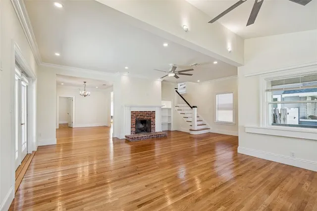 a kitchen with stainless steel appliances granite countertop a stove and a white cabinets