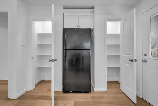 a refrigerator freezer sitting in a kitchen