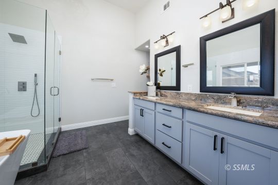 1221 Andrea Court Ridgecrest, CA 93555 - Photo 27 of 50 a bathroom with a granite countertop sink mirror and bathtub