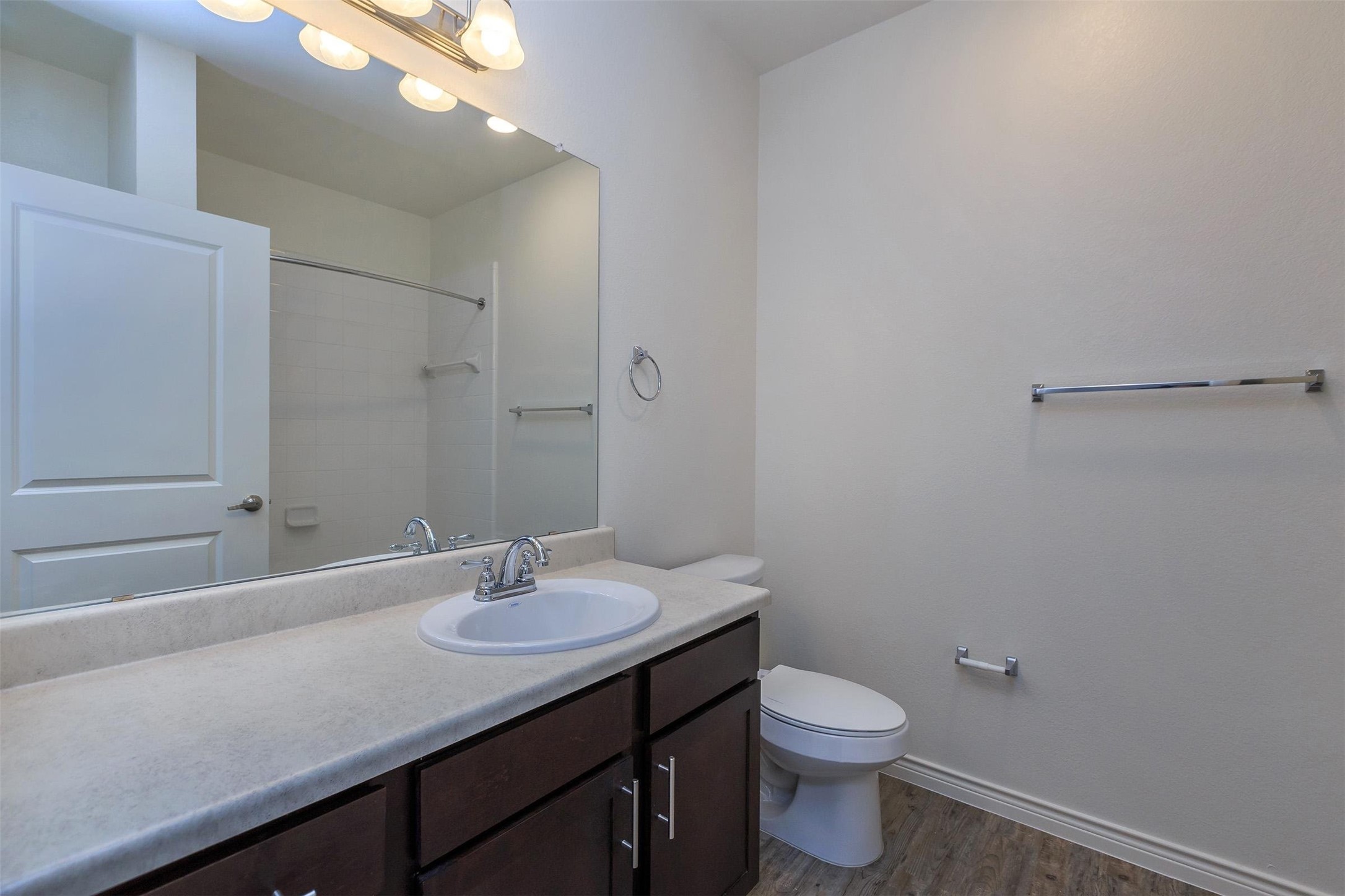5712 Azle Avenue Fort Worth, TX 76106 - Photo 14 of 15 a bathroom with a sink a toilet and shower