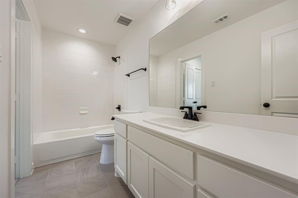 1841 Pk Vista Way Midlothian, TX 76065 - Photo 20 of 28 a bathroom with a sink a toilet and a bathtub