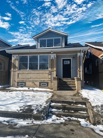 a front view of a house with a garage