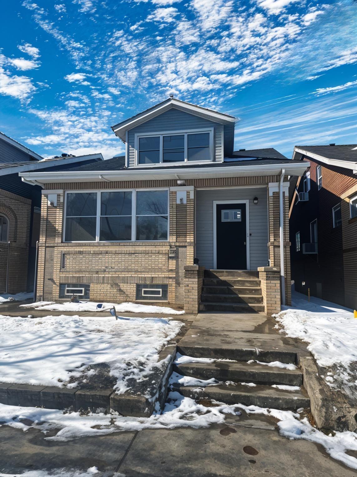 1320 Delaware Street Gary, IN 46407 - Photo 1 of 17 a front view of a house with a garage