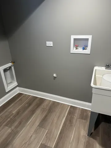 a room with a couch and a wooden floor