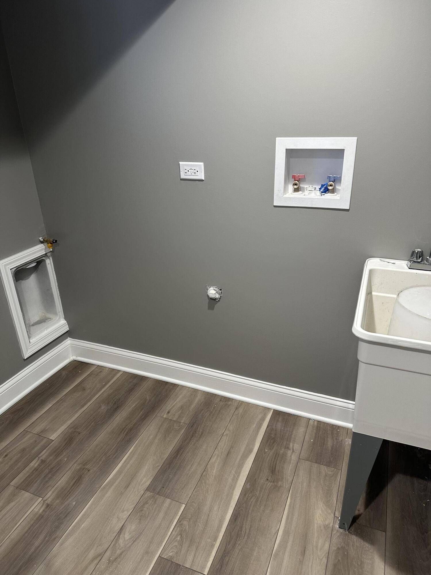 1320 Delaware Street Gary, IN 46407 - Photo 16 of 17 a room with a couch and a wooden floor