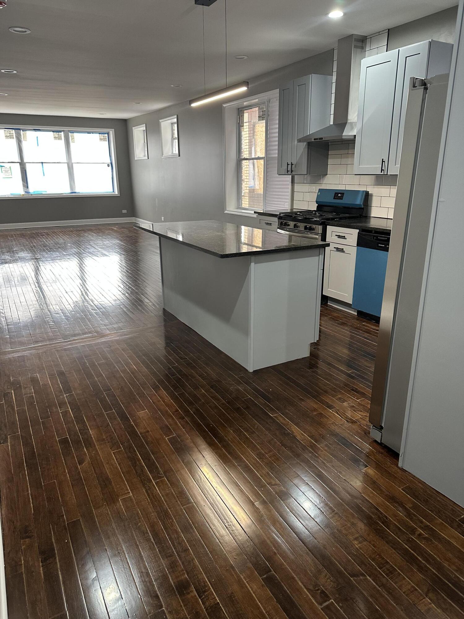1320 Delaware Street Gary, IN 46407 - Photo 2 of 17 a kitchen with stainless steel appliances granite countertop a stove a sink and a refrigerator