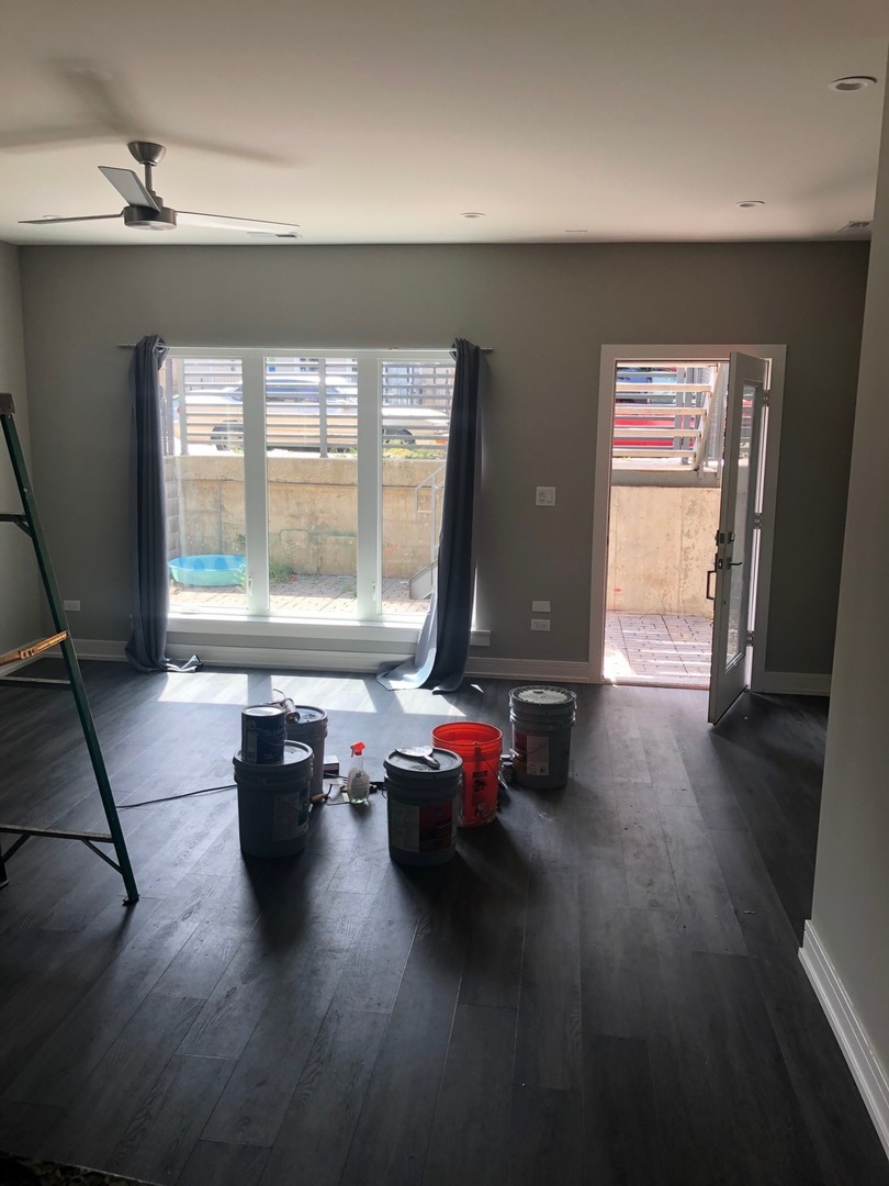1734 West Cullerton Street, Unit 1 Chicago, IL 60608 - Photo 3 of 12 a living room with hard wood floor