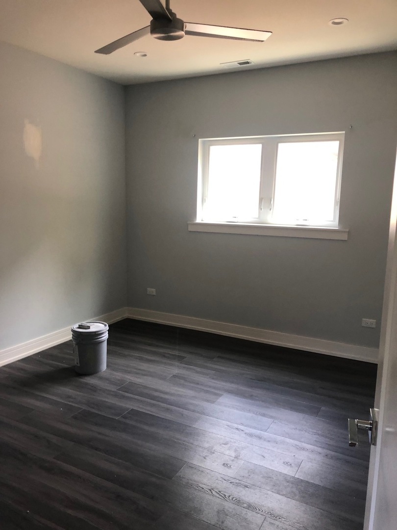 1734 West Cullerton Street, Unit 1 Chicago, IL 60608 - Photo 9 of 12 a view of an empty room with a window