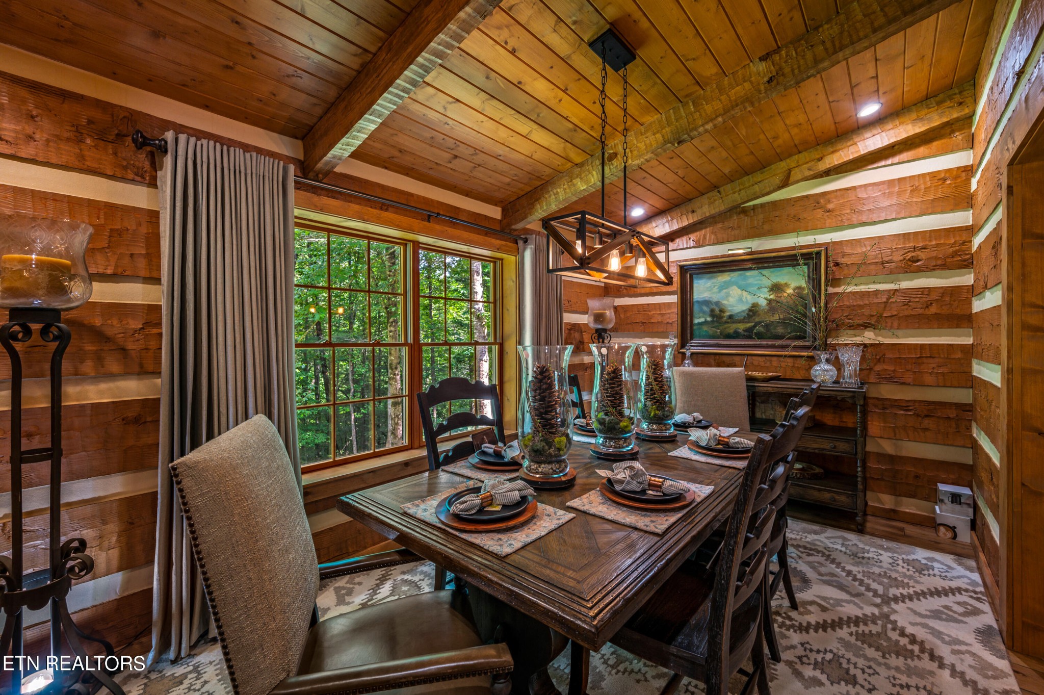 144 Lakeside Townsend, TN 37882 - Photo 26 of 56 a view of a dining room with furniture large windows and wooden floor