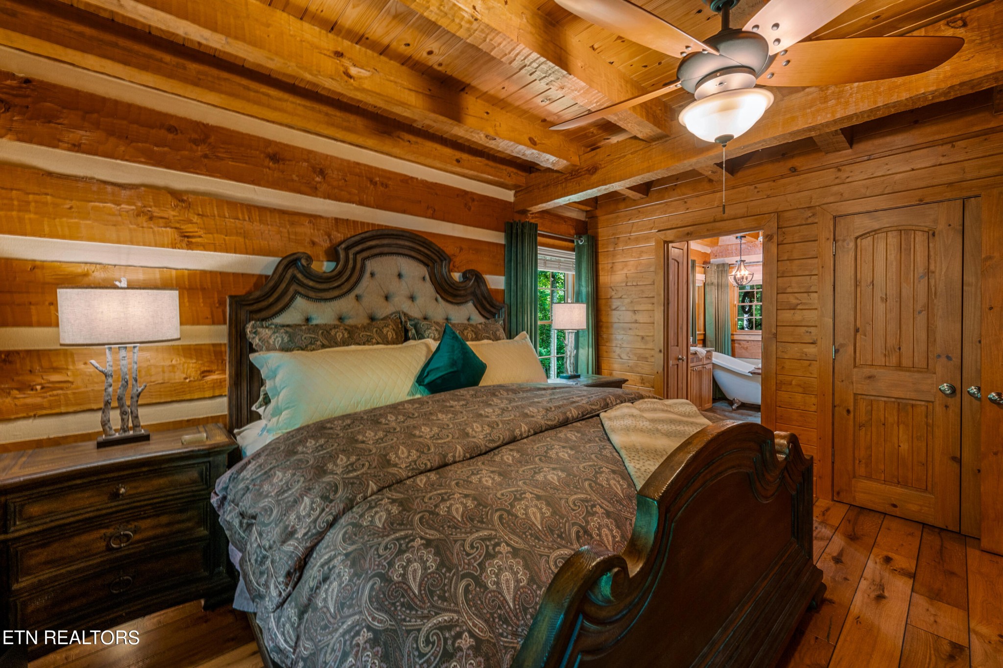 144 Lakeside Townsend, TN 37882 - Photo 29 of 56 a bed sitting in a bedroom next to a window