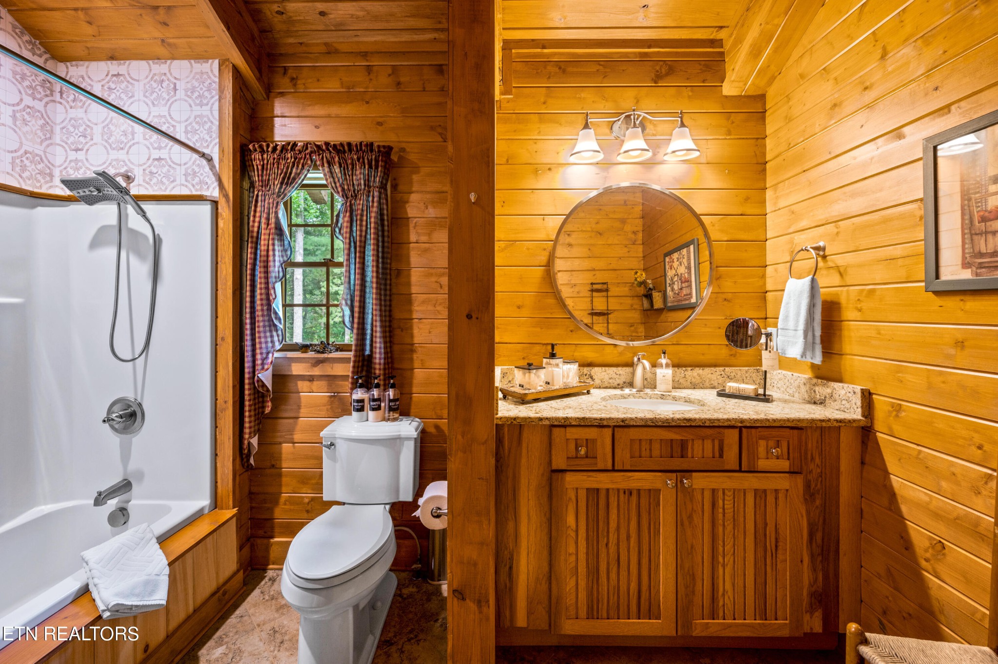 144 Lakeside Townsend, TN 37882 - Photo 38 of 56 a bathroom with a granite countertop toilet sink and mirror