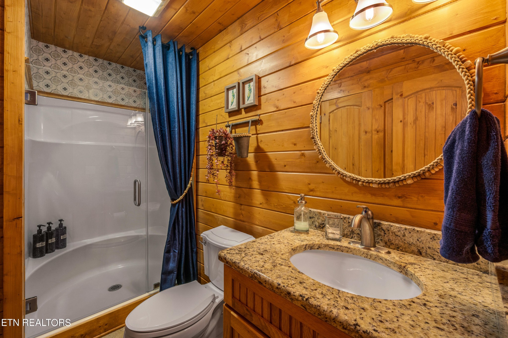 144 Lakeside Townsend, TN 37882 - Photo 43 of 56 a bathroom with a granite countertop sink toilet and shower