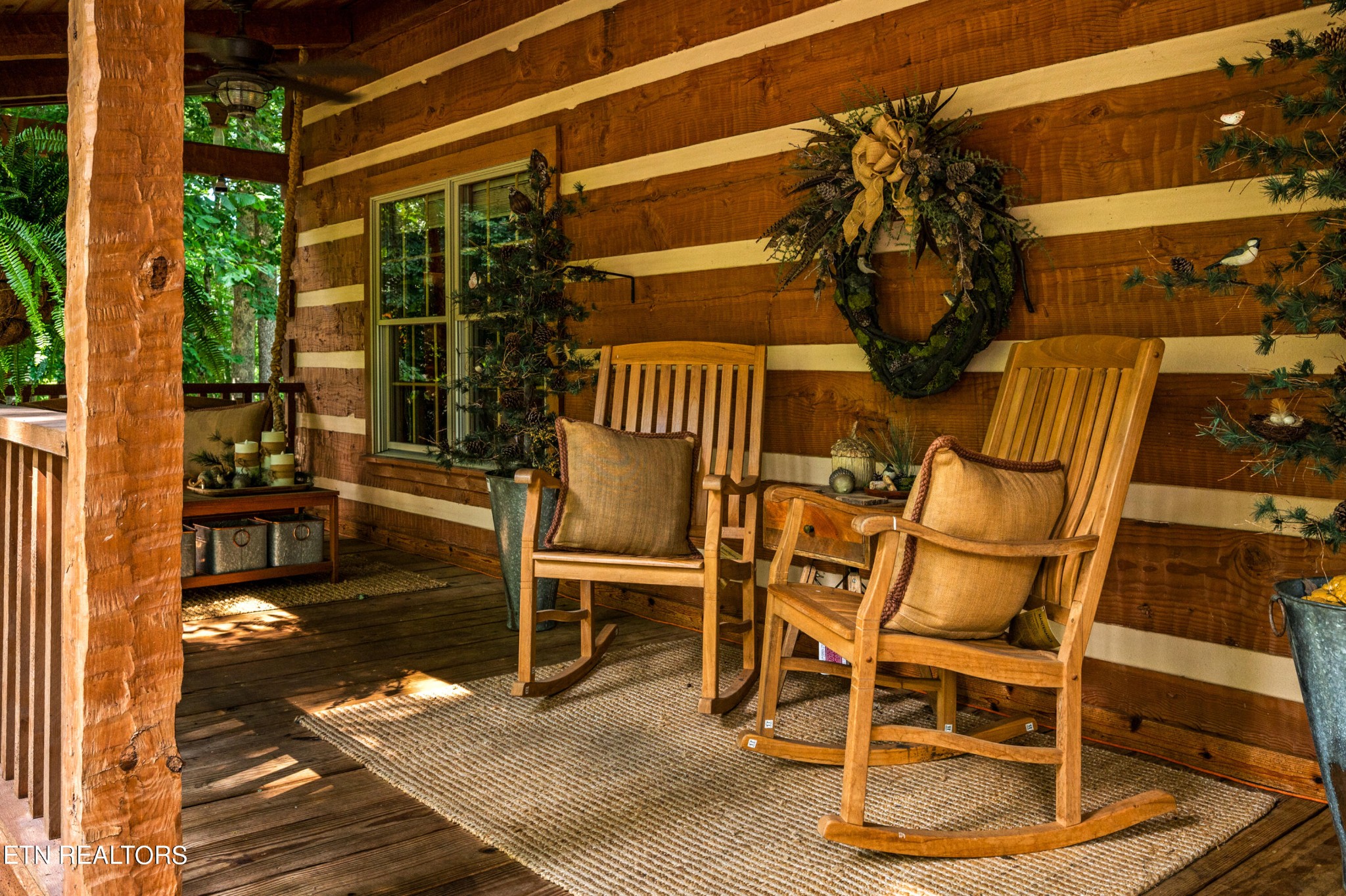 144 Lakeside Townsend, TN 37882 - Photo 5 of 56 a view of a patio with table and chairs with wooden floor and fence