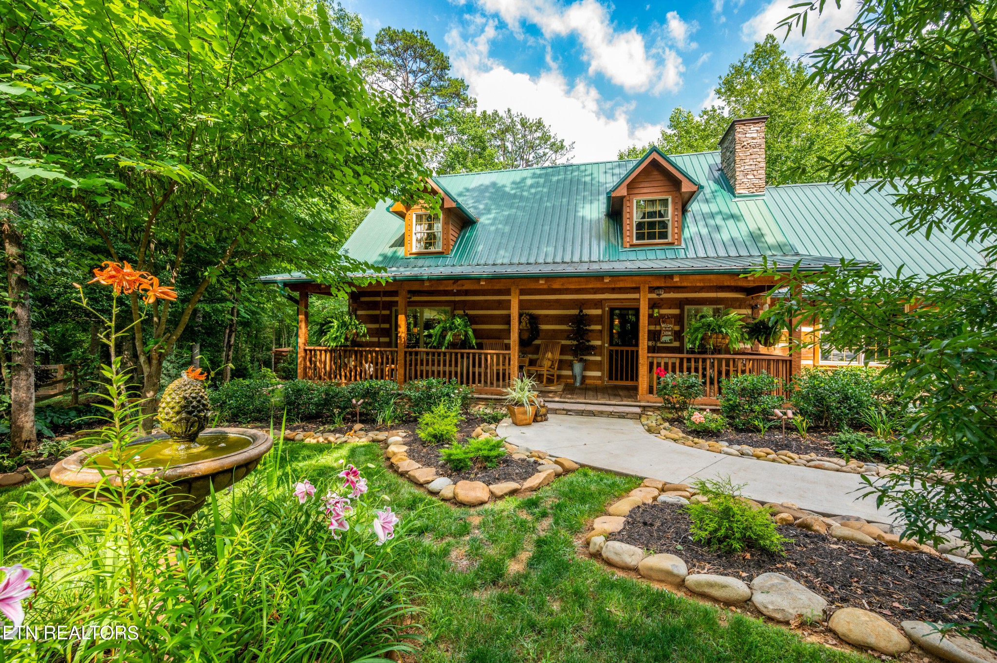 144 Lakeside Townsend, TN 37882 - Photo 54 of 56 a view of a house with sitting area and garden
