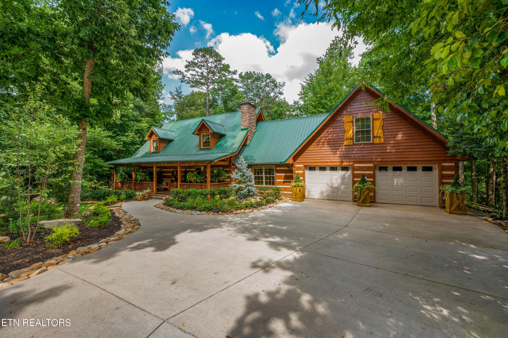 144 Lakeside Townsend, TN 37882 - Photo 55 of 56 a view of a house with a small yard and large tree