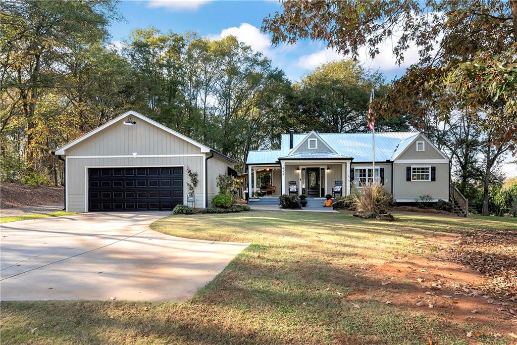 848 Hancock Bridge Road Winder, GA 30680 - Photo 1 of 1 a front view of a house with a yard and garage