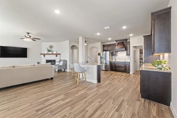 a front view of a house with a big yard