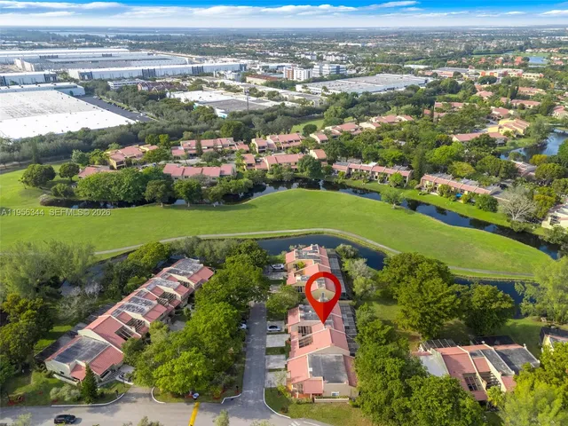 an aerial view of a houses and an outdoor space