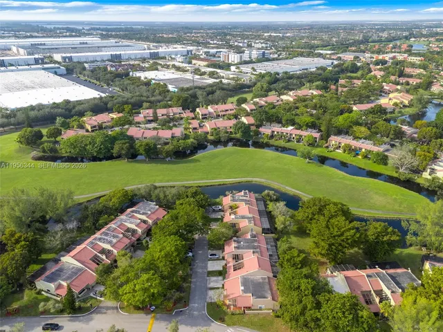 an aerial view of a houses with outdoor space and street view