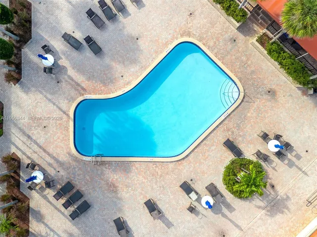 an aerial view of a house with a garden