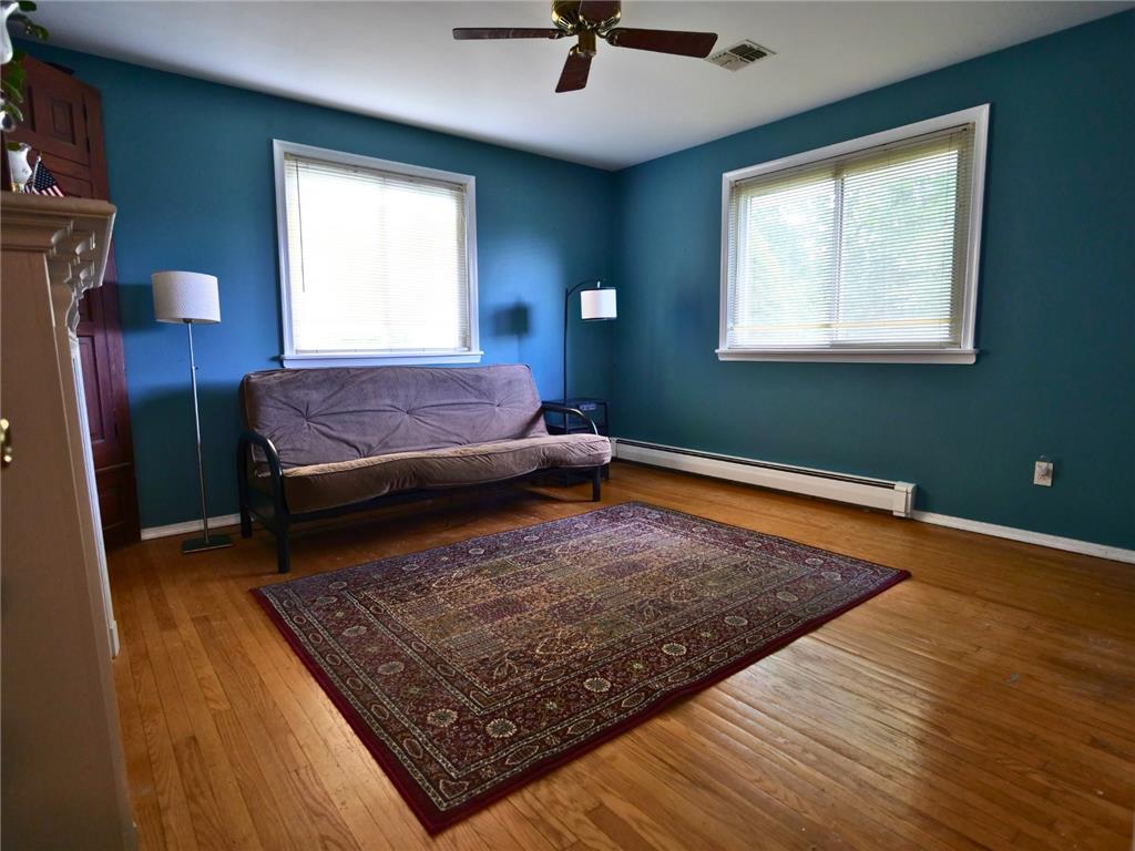2233 Aster Road Macungie, PA 18062 - Photo 13 of 30 a bed sitting in a bedroom next to a window