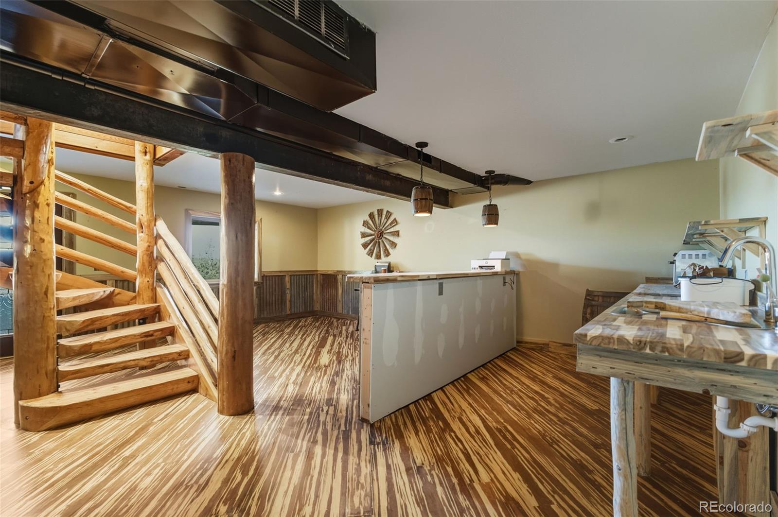 2925 Siloam Road Pueblo, CO 81005 - Photo 25 of 44 a view of a hallway with wooden floor and staircase