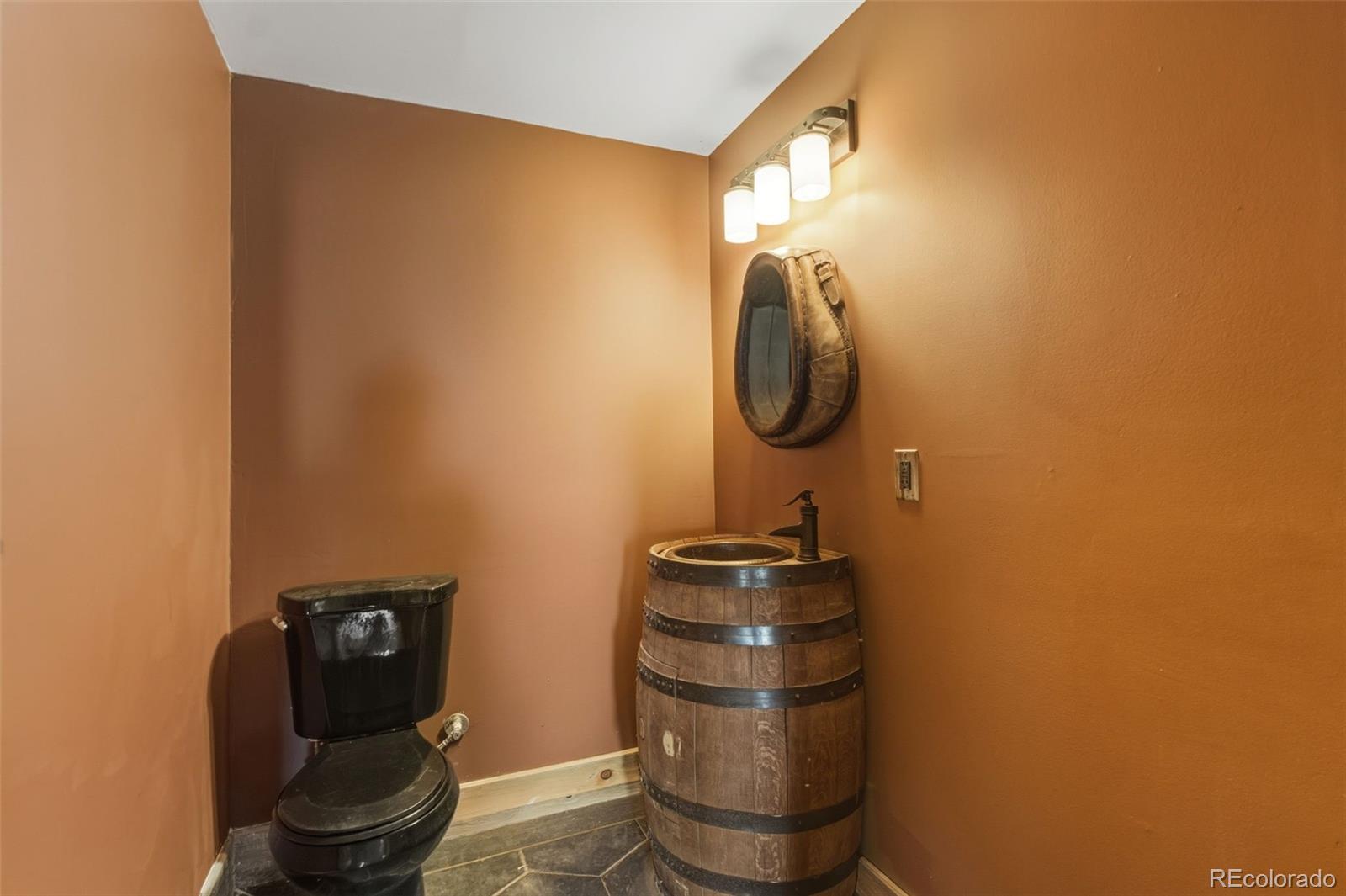 2925 Siloam Road Pueblo, CO 81005 - Photo 28 of 44 a bathroom with a toilet and a sink