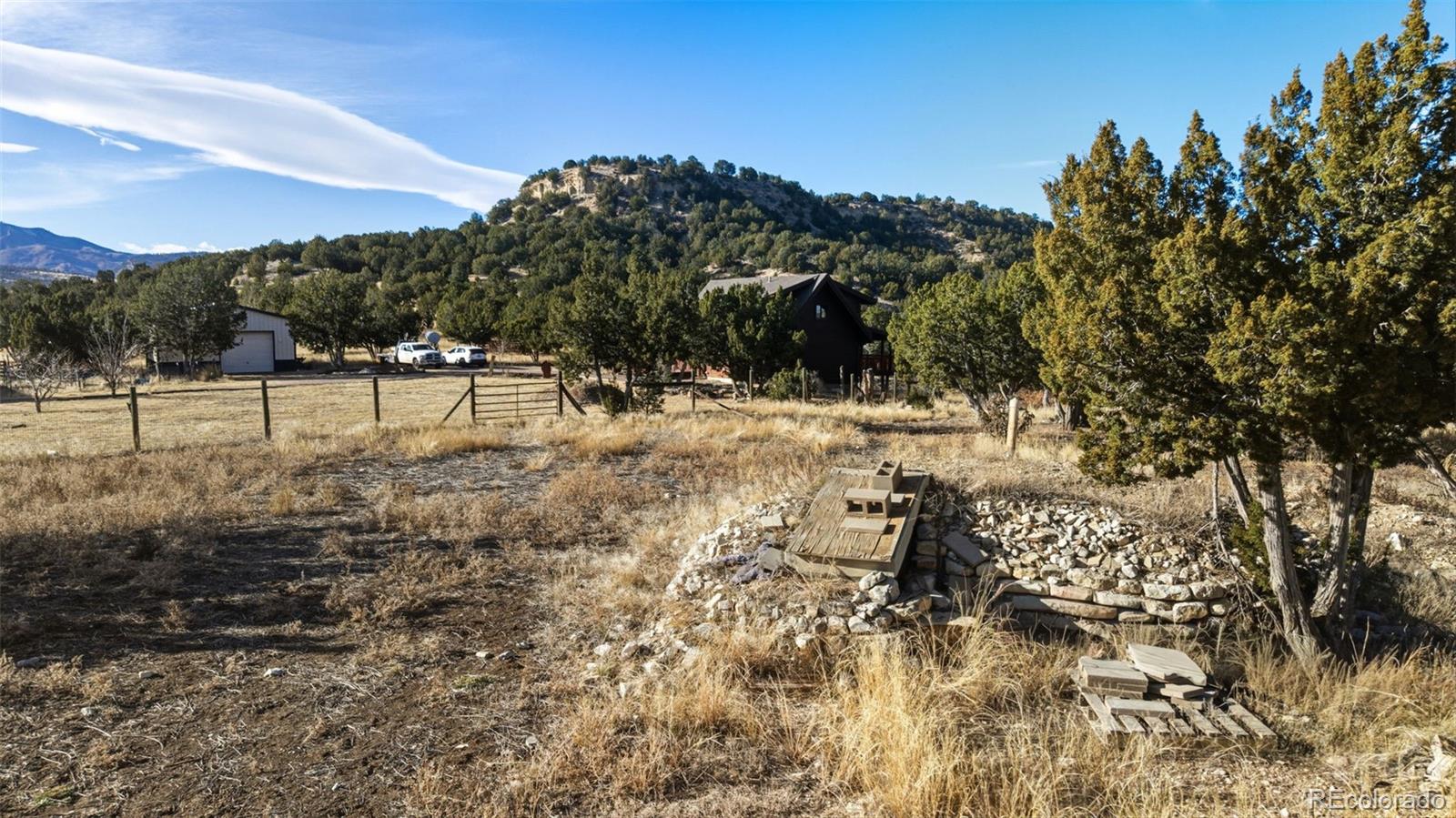 2925 Siloam Road Pueblo, CO 81005 - Photo 39 of 44 a view of a yard with trees in the background