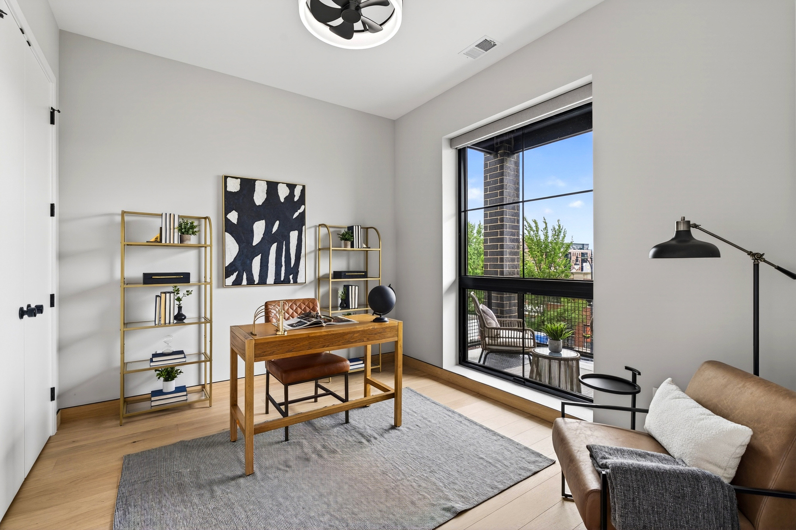 2024 West Irving Park Road, Unit 302 Chicago, IL 60618 - Photo 21 of 32 a work room with furniture and a floor to ceiling window