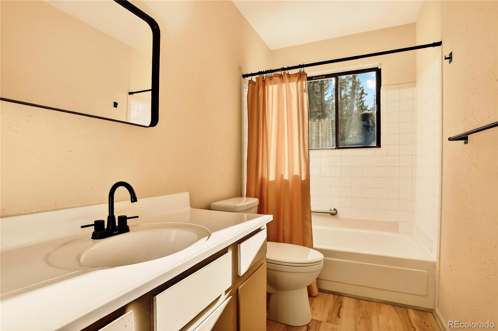 217 Catamount Ridge Road Bailey, CO 80421 - Photo 19 of 37 a bathroom with a sink toilet and shower