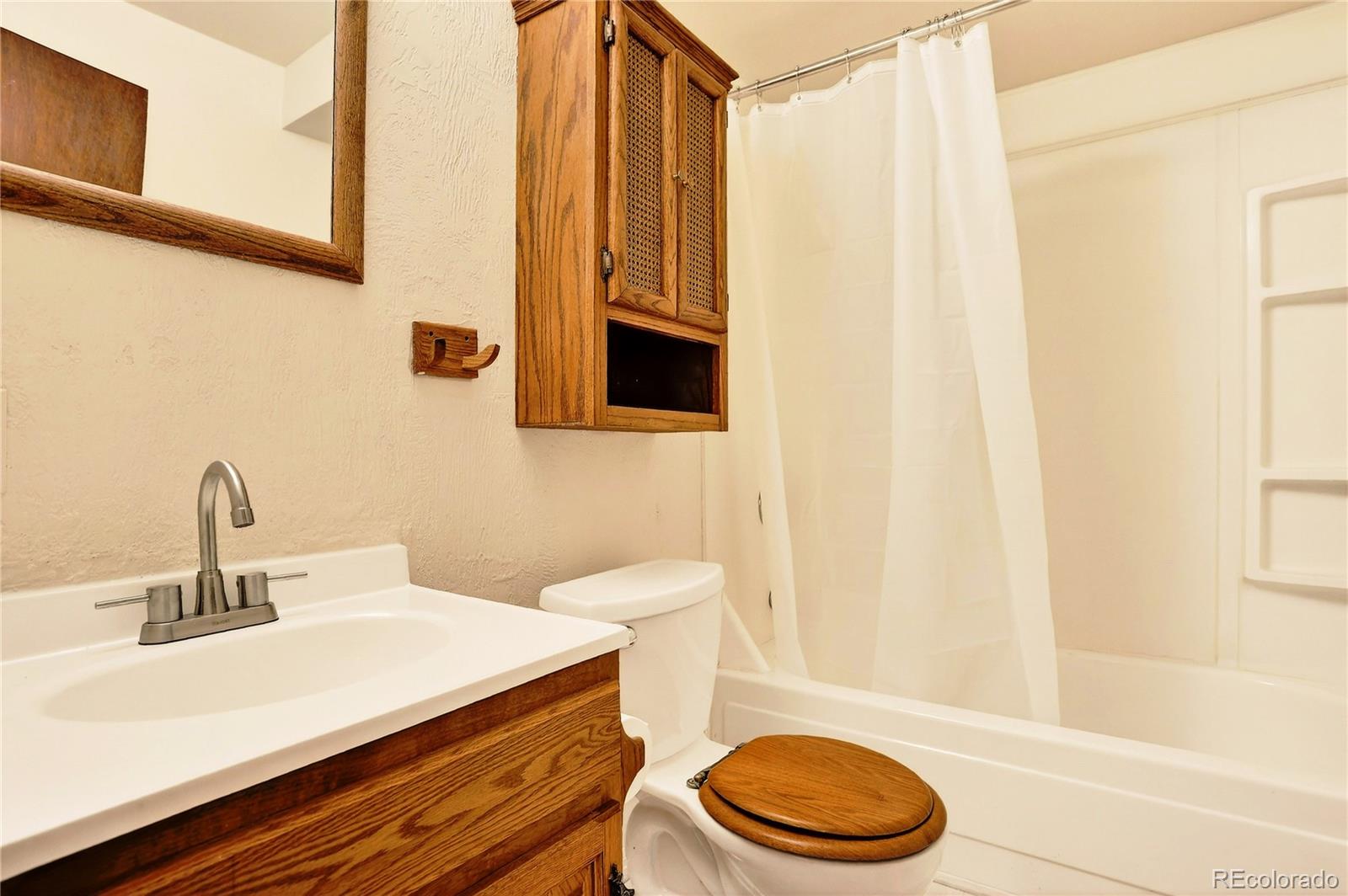 217 Catamount Ridge Road Bailey, CO 80421 - Photo 30 of 37 a bathroom with a sink a toilet and shower
