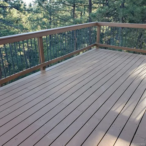 a view of balcony with wooden floor