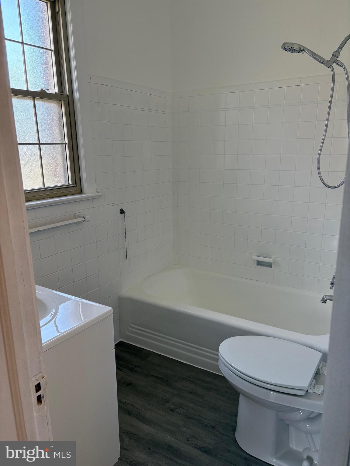 6722 3rd Street Northwest, Unit 204 Washington, DC 20012 - Photo 13 of 23 a bathroom with a toilet a sink and a bathtub
