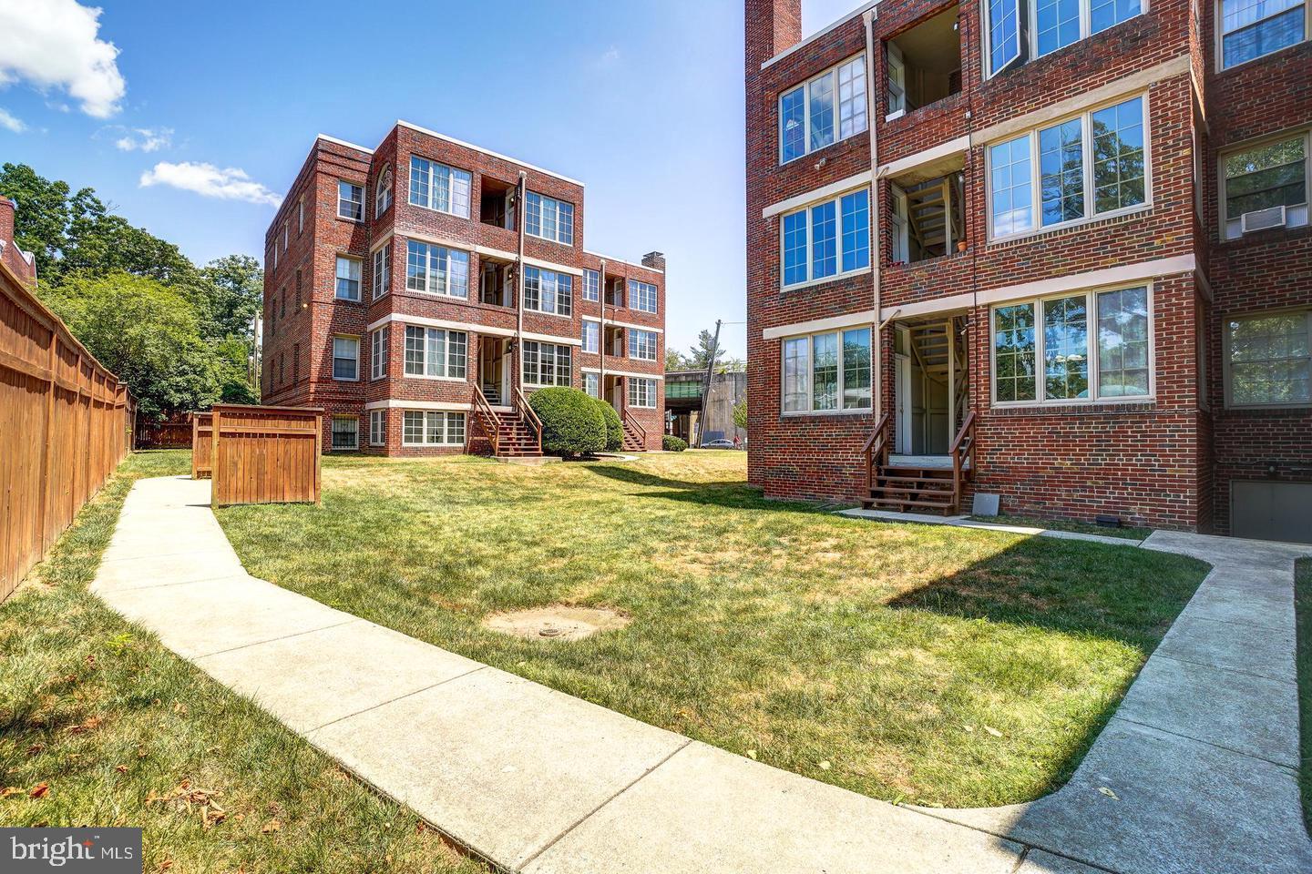 6722 3rd Street Northwest, Unit 204 Washington, DC 20012 - Photo 3 of 23 a view of building with yard