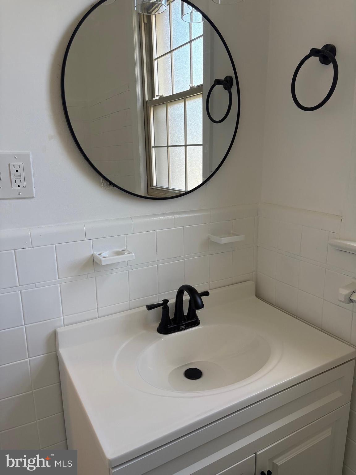 6722 3rd Street Northwest, Unit 204 Washington, DC 20012 - Photo 10 of 23 a bathroom with a sink and mirror