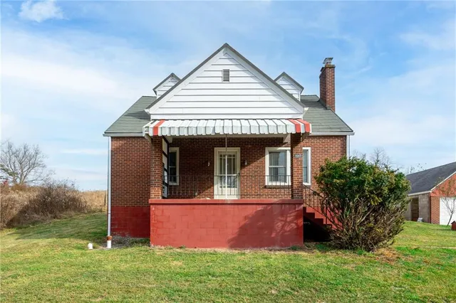 front view of a house with a yard