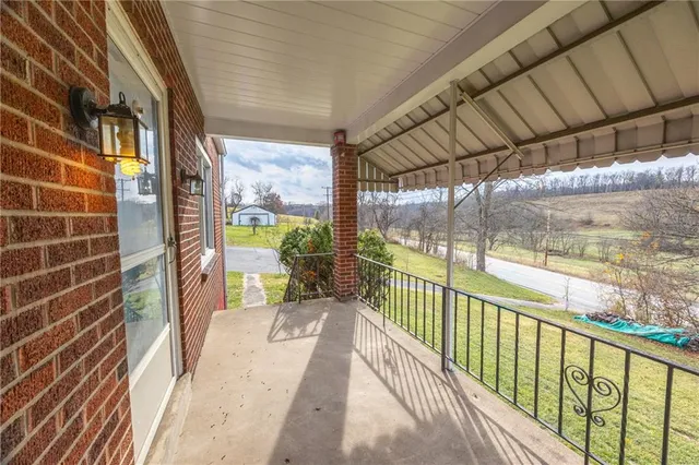 a view of balcony with wooden floor
