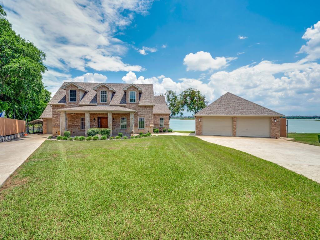 5975 Diamond Spur Frisco, TX 75036 - Photo 38 of 40 a front view of house with yard and trees