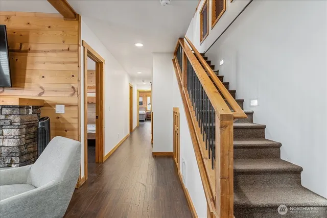 a view of staircase with wooden floor and stairs