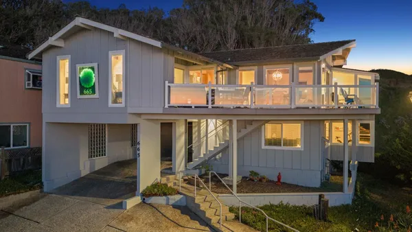 a living room filled with furniture and a fireplace